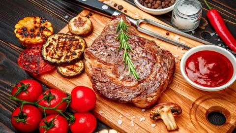 Meat on the barbecue Stock Photos