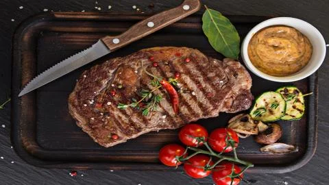 Meat on the barbecue Stock Photos