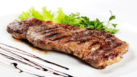 Meat on the barbecue Stock Photos