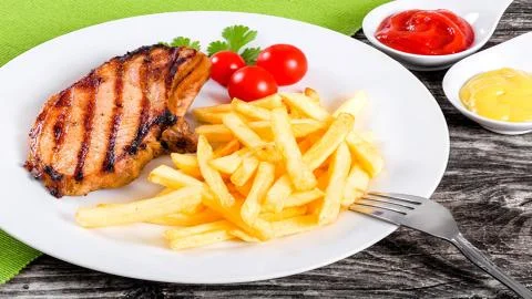 Meat on the barbecue Stock Photos