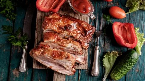 Meat on the barbecue Stock Photos