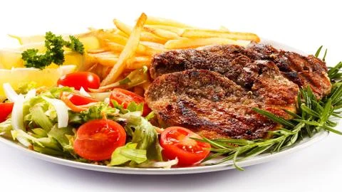 Meat on the barbecue Stock Photos