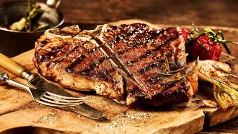 Meat on the barbecue Stock Photos