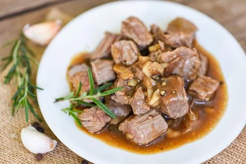 Meat beef cube roast bbq with sauce and spices garlic - beef cuts and cooke.. Stock Photos