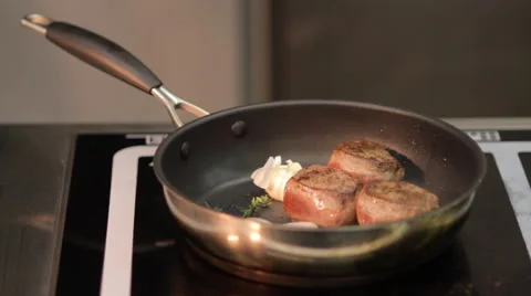 Meat being cooked in a stove Stock Footage 64128081