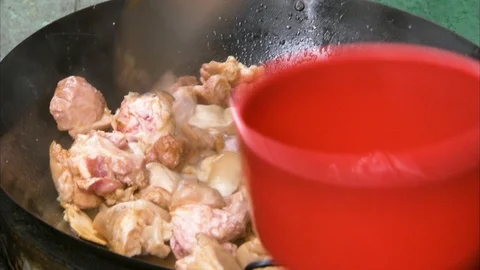Meat being cooked in a wok Stock-Footage 88889364