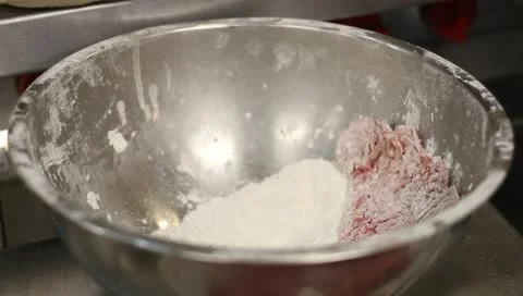 Meat being floured Stock-Footage 10681871
