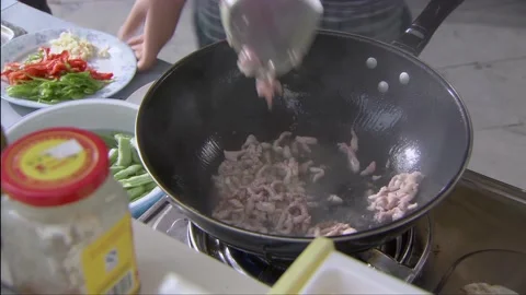 Meat is being fried in the pot Stock Footage 253770967