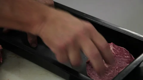 Meat being packed Video stock 32403263