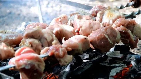 Meat being roasted over coals Stock Footage 77861381