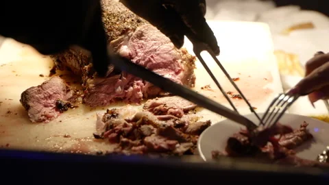 Meat being served from cutting board Stock Footage 170384570