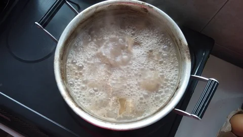 Meat boil in a pot. Stock Footage 105400102