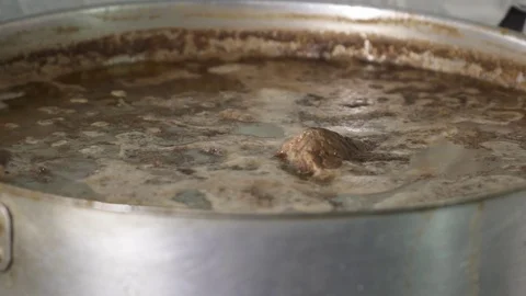 Meat boiling in pot, soup preparing Stock Footage 73620723