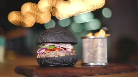 Meat burger with black bun Stock Footage 132641214