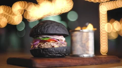 Meat burger with black bun Stock Footage 132641231