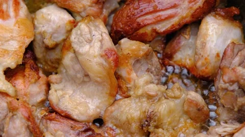 Meat in a cauldron. Eastern cuisine. Fried meat with crust. Stock Footage 212426780