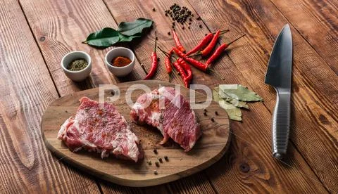 Meat with chili, cayenne powder and some spices Stock Photos