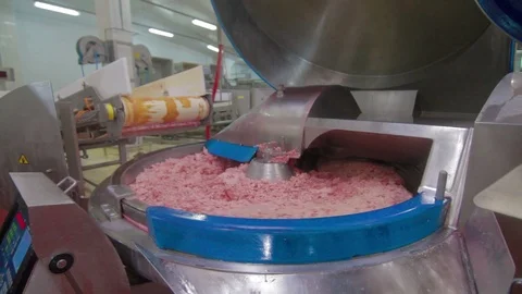 Meat chopper machine, mixing meat and spices for making sausages in food factory Stock Footage 94144058