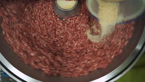 Meat chopper machine, mixing meat and spices for making hot dogs and sausages in Vídeo Stock 131870036