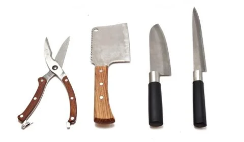Meat cleaver, kitchen scissors and knives Stock Photos