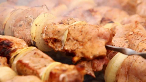 Meat close up footage being fried and rotated during cooking process on barbecue Stock-Footage 140686997