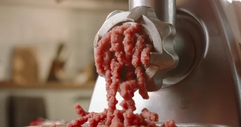 Premium Photo  Raw minced beef and pork chopped in meat grinder, close-up  food background