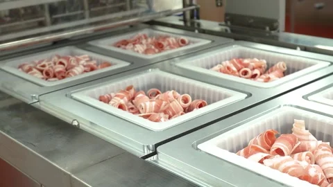 Meat Containers Being Automatically Packaged in Food Factory Stock Footage 335258424