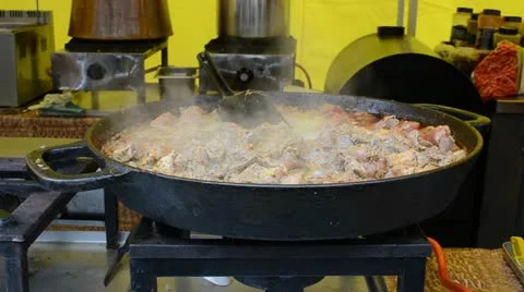 Meat cook pan fire and vapour rise outdoor restaurant Stock Footage 15798009