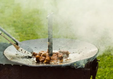 The meat is cooked in a cauldron Stock Photos