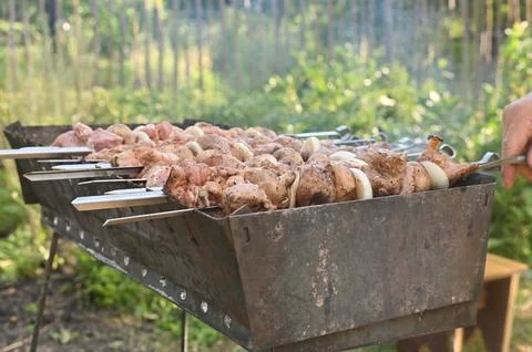 Meat is cooked on the grill Stock Photos