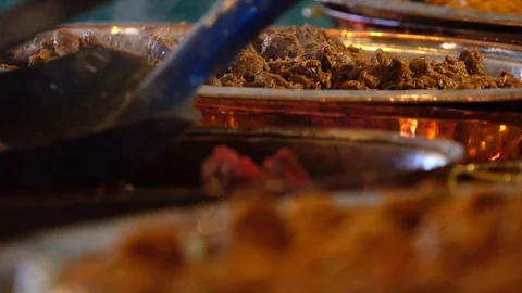 Meat cooked inside a traditional copper pot Stock Footage 99249689