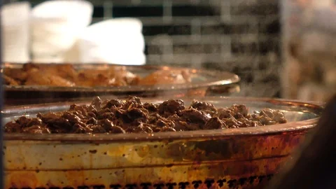Meat cooked inside a traditional copper pot Vidéo 99249728