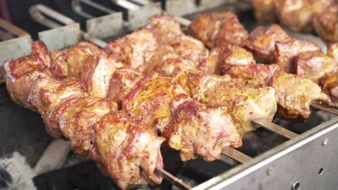 Meat is cooked on an open fire on the street. kebab. Stock Footage 131712647