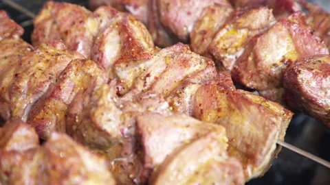 Meat is cooked on an open fire on the street. kebab. Stock Footage 131712858