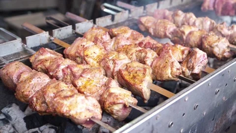 Meat is cooked on an open fire on the street. kebab. Stock Footage 131712987