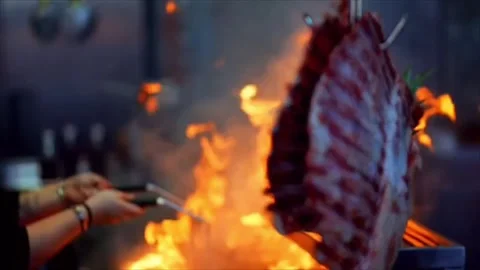 Meat cooked over fire in a restaurant kitchen Stock Footage 292923872