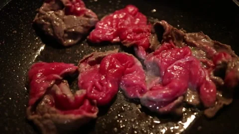 Meat cooked in a pan Stock Footage 304487183
