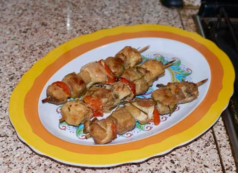 Meat cooked on a spit Stock Photos