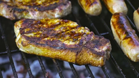 Meat Cooking on a Barbecue in 4K Vidéo 336195343
