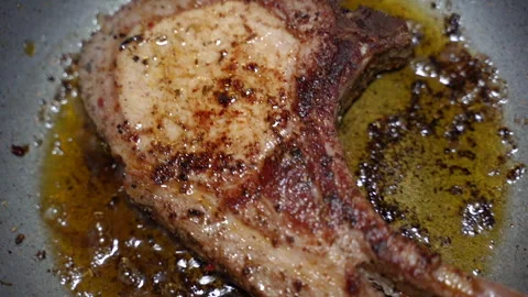 Meat. Cooking meat on the bone. Tomahawk steak. Stock Footage 244087962