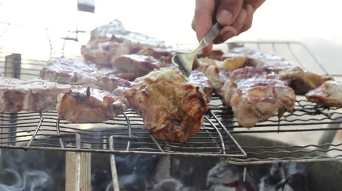 Meat cooking on an open fire Stock Footage 42684009