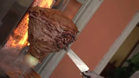 Meat cooking on a spit Stock-Footage 11677665