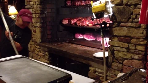 Meat cooking in stone Stock Footage 74477168