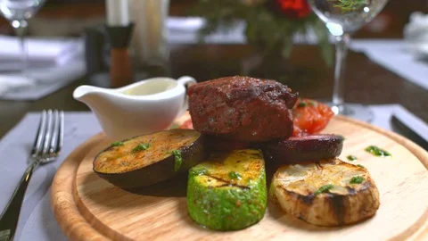 Meat is cut with a fork and knife Stock Footage 74989561