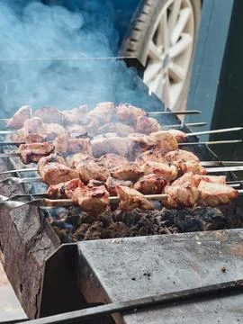Meat is cut into medium-sized pieces and grilled evenly on the grill Stock Photos