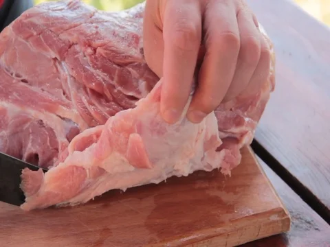 Meat is cut on the table Stock Footage