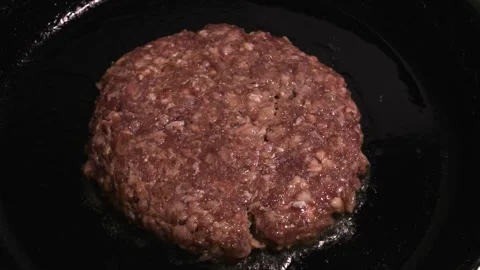 Meat cutlet is fried in a pan. Stock Footage 248063271