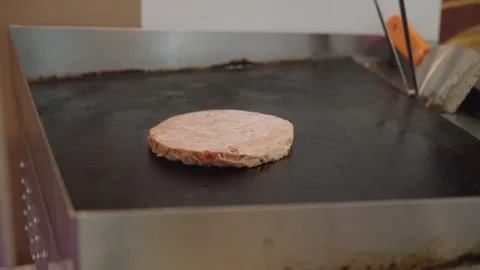 Meat cutlet on frying pad close up. Semi-finished product cooking process. Video stock 304317652