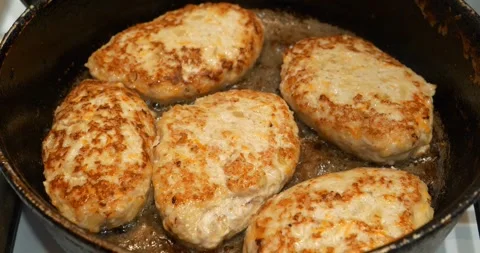 Meat cutlets are fried in a frying pan. Cooking, frying meat. Fat unhealthy food Stock-Footage 317048757