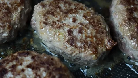 Meat cutlets are fried in a pan Stock Footage 170217411